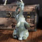 Un conjunto decorativo de figuritas de madre y elefante, perfecto para regalos del Día de la Madre.