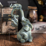 Un conjunto decorativo de figuritas de madre y elefante, perfecto para regalos del Día de la Madre.