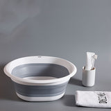 Un lavabo portátil plegable para la ropa que se puede utilizar tanto para remojar los pies como para lavar en apartamentos, con un diseño moderno y múltiples usos, incluyendo bañeras de pies y lavado de autocaravanas.