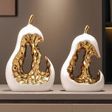 1 pieza de moderna escultura de pera de cerámica abstracta - Elegante adorno decorativo dorado y blanco para el hogar o la oficina, regalo perfecto para las vacaciones, exhibición en la mesa o el armario, decoración de oficina