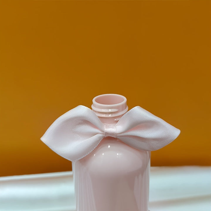 1/2 piezas 250ml Botella vacía de tipo prensa rosa con lazo, Detergente para ropa Gel de ducha Champú Loción Acondicionador Botella recargable dividida, Decoración del hogar