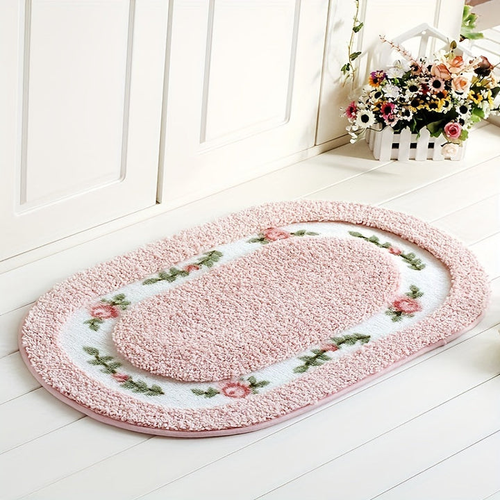 Una alfombra ovalada en la entrada, una alfombra junto a la cama cerca de la ventana salediza, una alfombra antideslizante para el baño y una alfombra absorbente para el cuarto de baño.