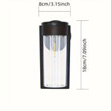 2 luces de pared solares para exteriores con bombillas de filamento de wolframio - Diseño moderno y elegante en negro, sensor automático para jardín, césped, patio, garaje y puerta principal, iluminación decorativa, luces solares para exteriores, ilumina