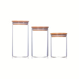 Doce recipientes de almacenamiento de granos, café y mora de vidrio de alta borosilicato de 210ml/280ml/340ml con tapa redonda de madera transparente.